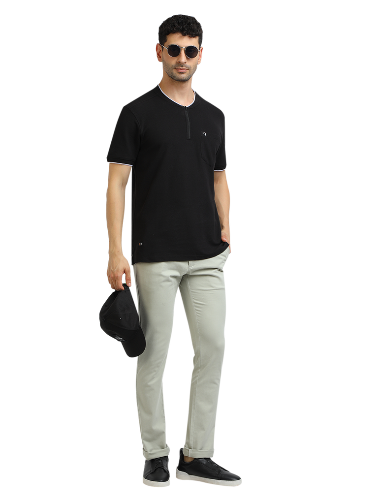 Model wearing Clarke Gable's Black Solid Henley Neck T-Shirt in a casual setting