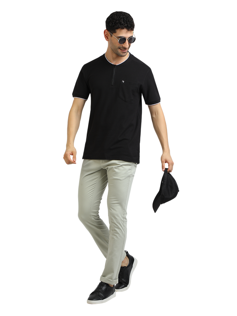 Model wearing Clarke Gable's Black Solid Henley Neck T-Shirt in a casual setting