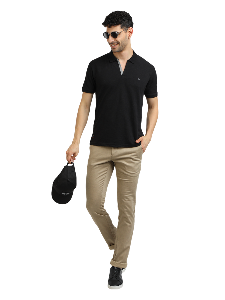 Model wearing Clarke Gable's Black Solid Polo Collar T-Shirt in a casual setting