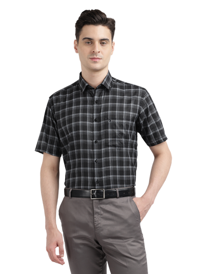 Model wearing Clarke Gable's Black With White Checked Formal Shirt in a casual setting