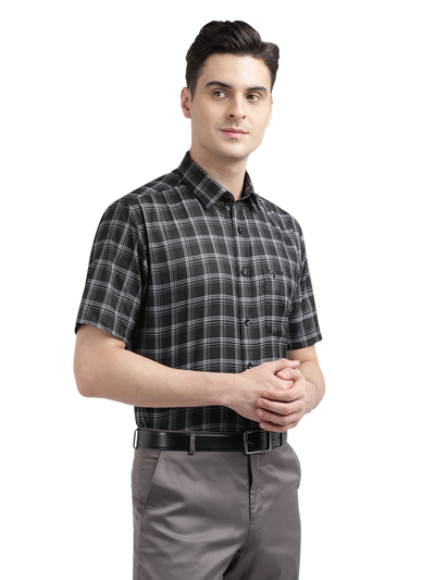 Model wearing Clarke Gable's Black With White Checked Formal Shirt in a casual setting