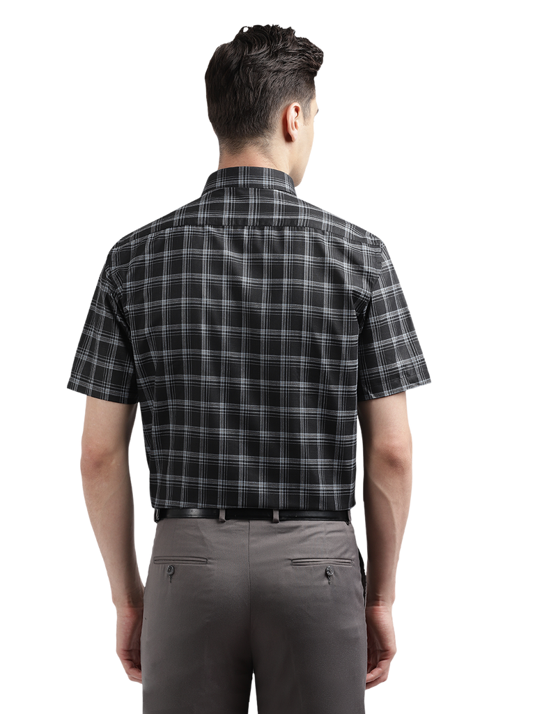 Model wearing Clarke Gable's Black With White Checked Formal Shirt in a casual setting