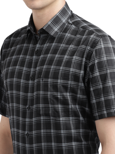 Model wearing Clarke Gable's Black With White Checked Formal Shirt in a casual setting