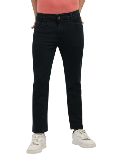 Model wearing Clarke Gable's Green Tinted Black Slim Fit Jeans in a casual setting