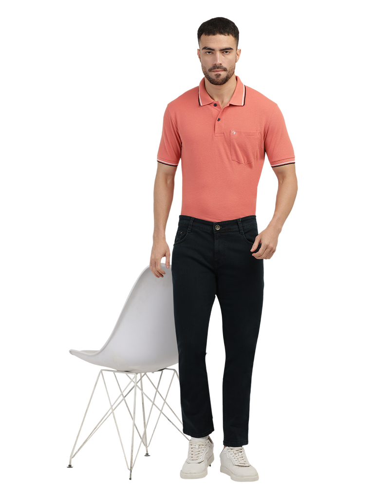 Model wearing Clarke Gable's Green Tinted Black Slim Fit Jeans in a casual setting