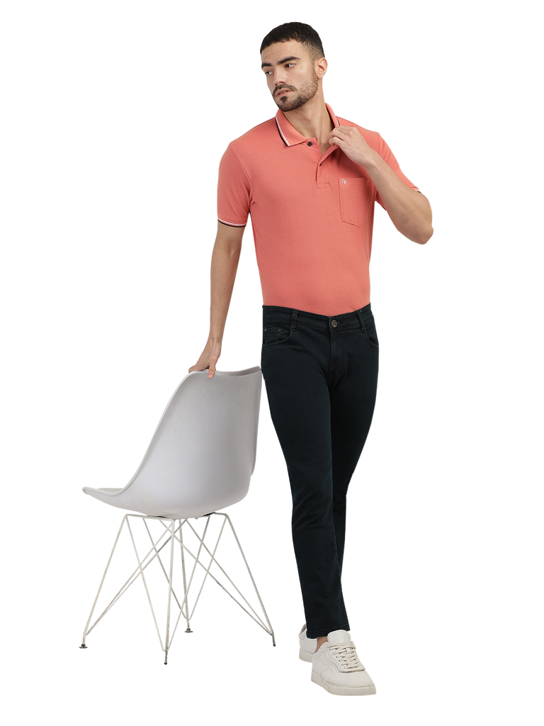 Model wearing Clarke Gable's Green Tinted Black Slim Fit Jeans in a casual setting