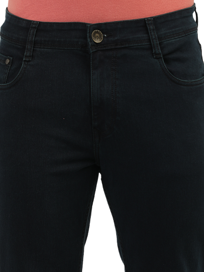 Model wearing Clarke Gable's Green Tinted Black Slim Fit Jeans in a casual setting