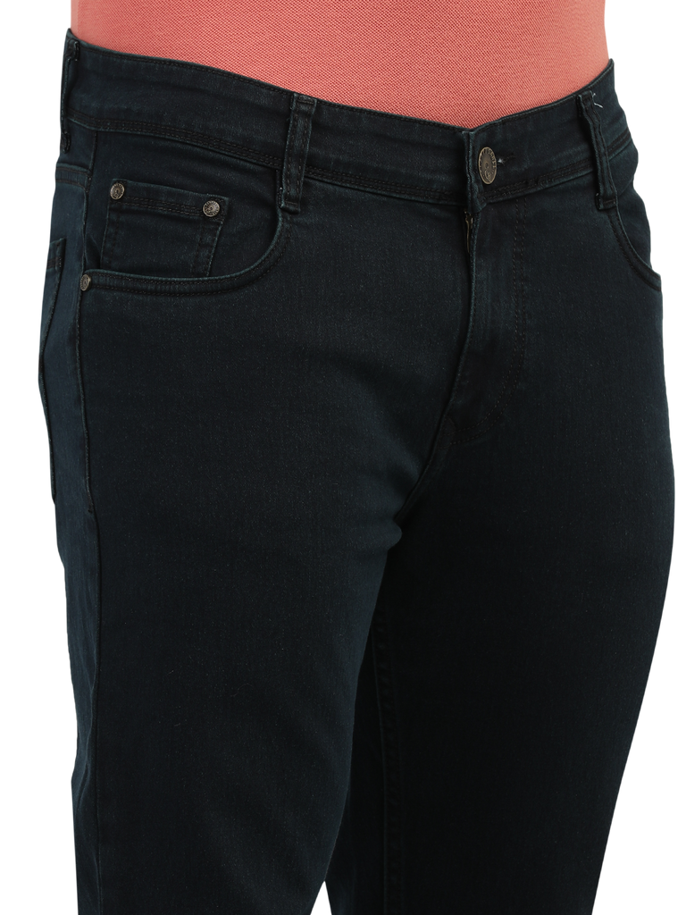 Model wearing Clarke Gable's Green Tinted Black Slim Fit Jeans in a casual setting