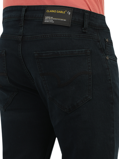 Model wearing Clarke Gable's Green Tinted Black Slim Fit Jeans in a casual setting