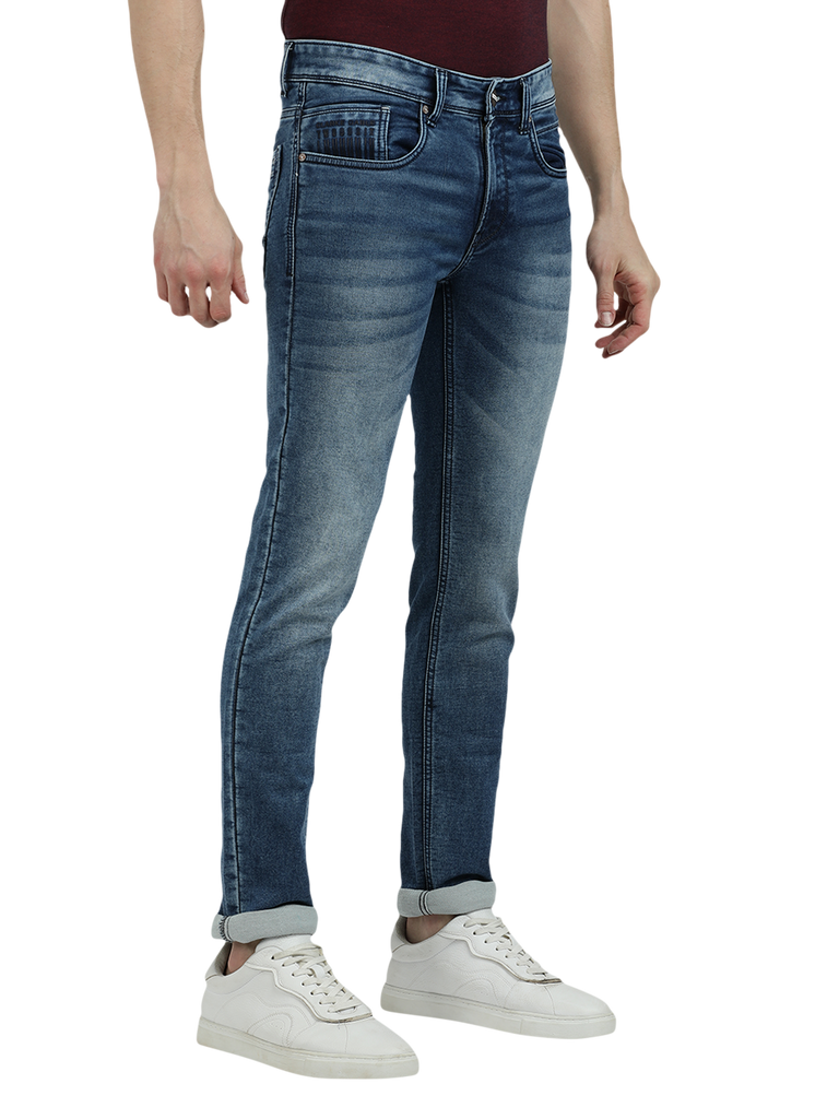 Model wearing Clarke Gable's Blue Whiskers Fade Skinny Fit Jeans in a casual setting