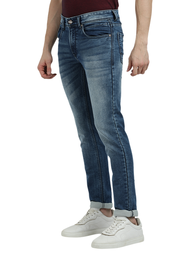 Model wearing Clarke Gable's Blue Whiskers Fade Skinny Fit Jeans in a casual setting