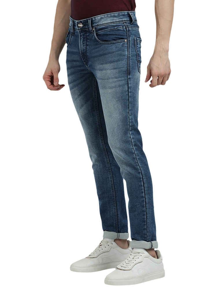 Model wearing Clarke Gable's Blue Whiskers Fade Skinny Fit Jeans in a casual setting