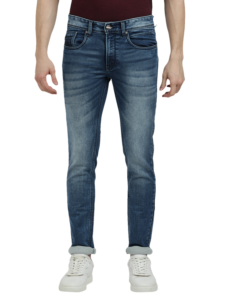 Model wearing Clarke Gable's Blue Whiskers Fade Skinny Fit Jeans in a casual setting