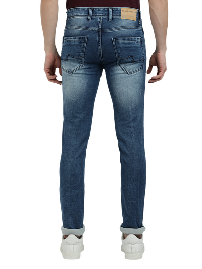 Model wearing Clarke Gable's Blue Whiskers Fade Skinny Fit Jeans in a casual setting
