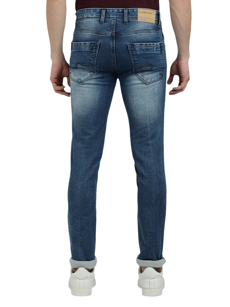 Model wearing Clarke Gable's Blue Whiskers Fade Skinny Fit Jeans in a casual setting