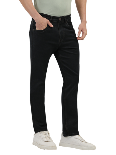 Model wearing Clarke Gable's Brown Tinted Smart Fit Jeans in a casual setting