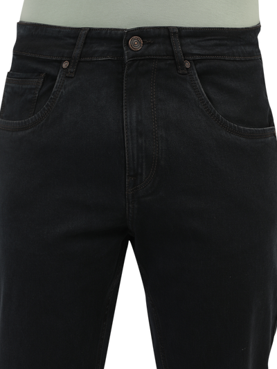 Model wearing Clarke Gable's Brown Tinted Smart Fit Jeans in a casual setting