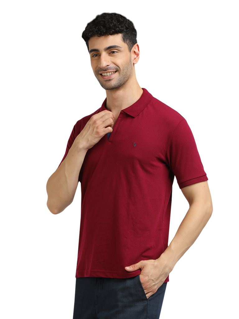 Model wearing Clarke Gable's Burgundy Solid Polo Collar T-Shirt in a casual setting