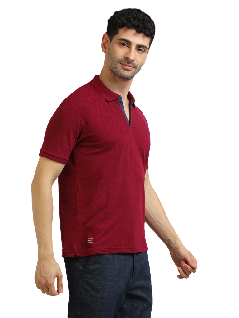 Model wearing Clarke Gable's Burgundy Solid Polo Collar T-Shirt in a casual setting