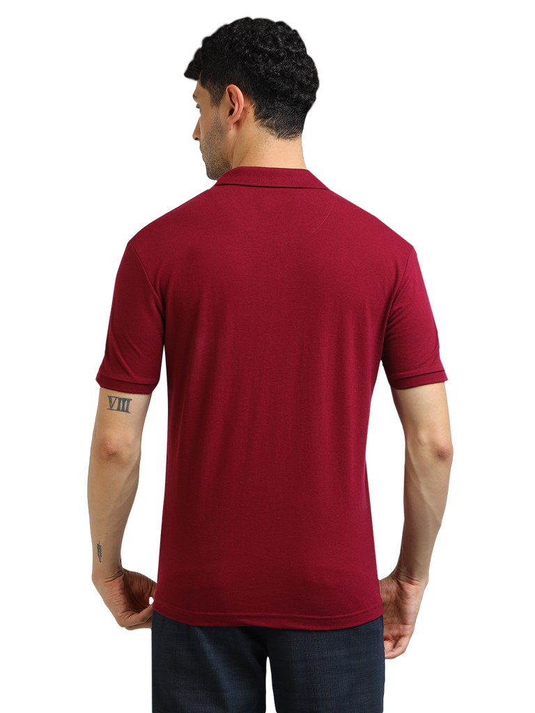 Model wearing Clarke Gable's Burgundy Solid Polo Collar T-Shirt in a casual setting