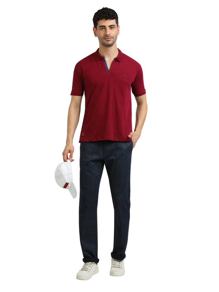 Model wearing Clarke Gable's Burgundy Solid Polo Collar T-Shirt in a casual setting