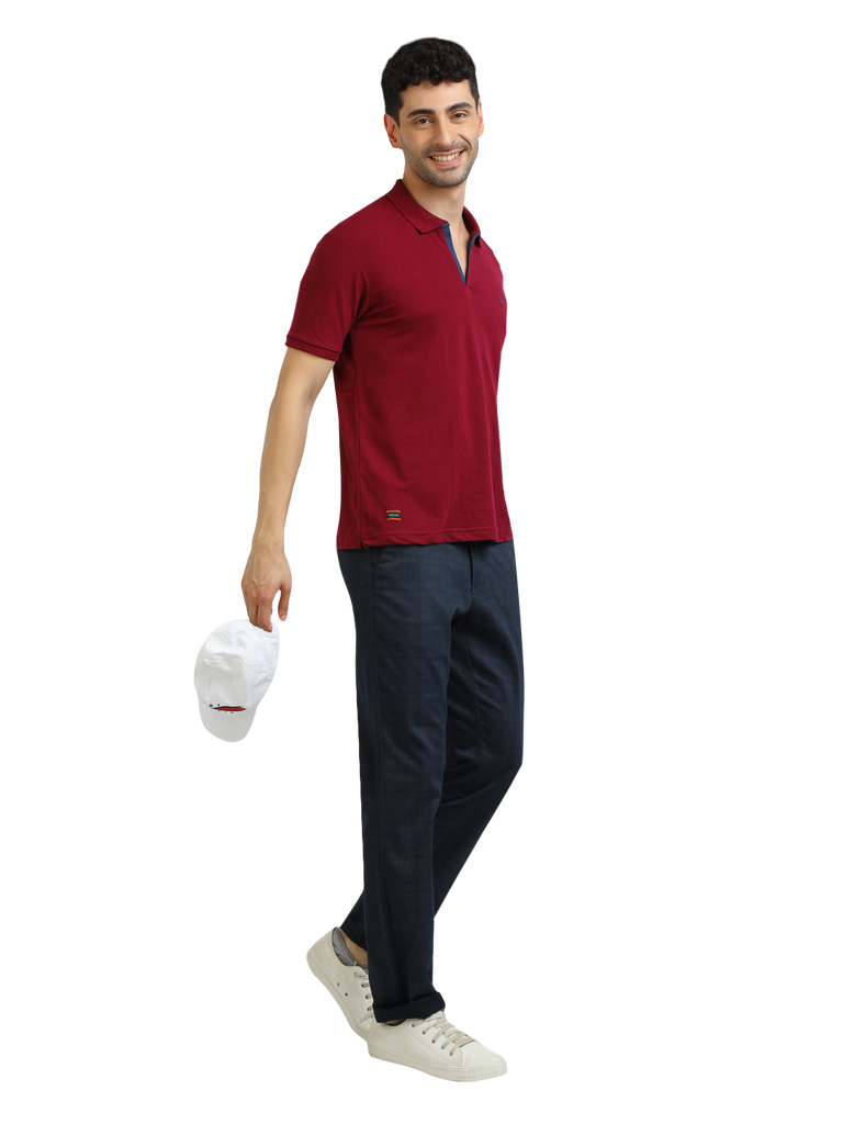 Model wearing Clarke Gable's Burgundy Solid Polo Collar T-Shirt in a casual setting