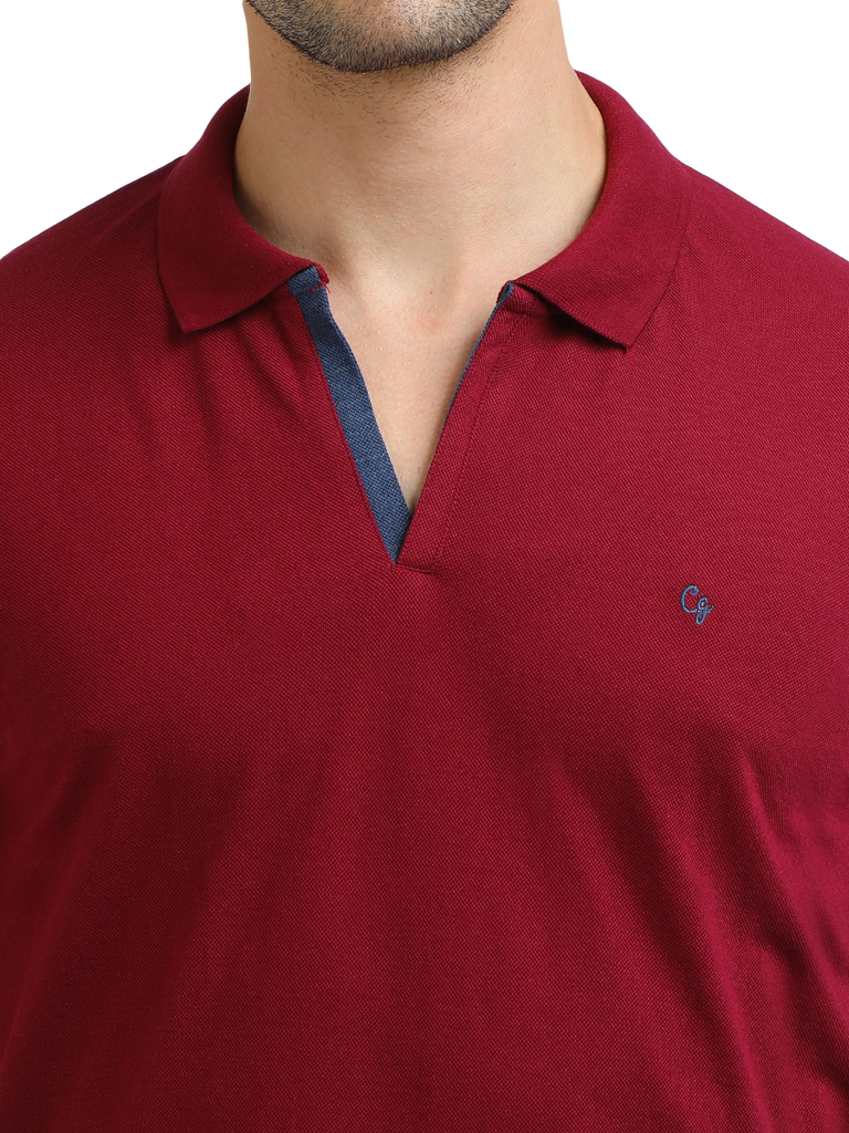 Model wearing Clarke Gable's Burgundy Solid Polo Collar T-Shirt in a casual setting