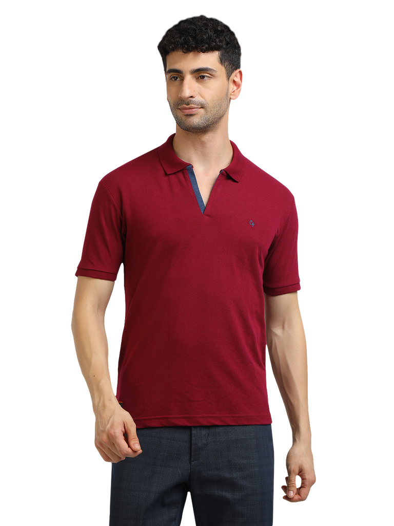 Model wearing Clarke Gable's Burgundy Solid Polo Collar T-Shirt in a casual setting