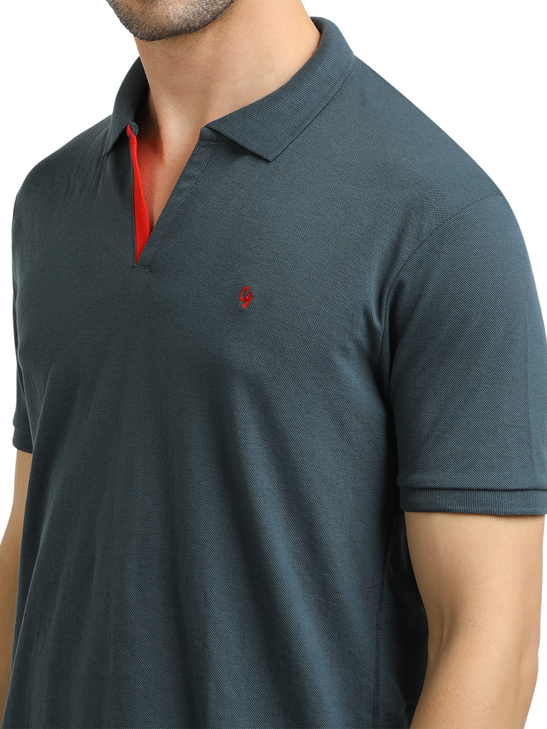 Model wearing Clarke Gable's Charcoal Solid Polo Collar T-Shirt in a casual setting