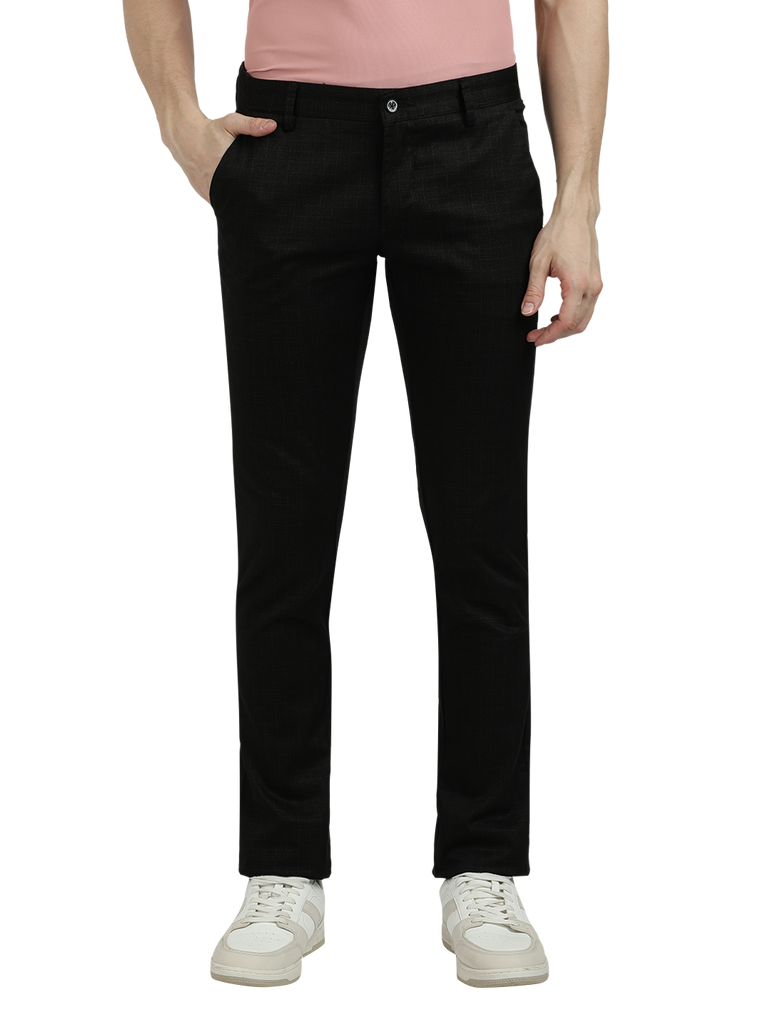 Model wearing Clarke Gable's Black Trim Fit Trousers in a casual setting