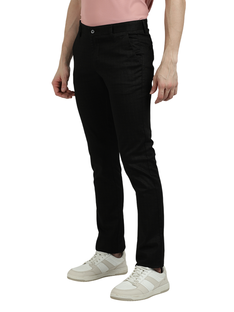 Model wearing Clarke Gable's Black Trim Fit Trousers in a casual setting