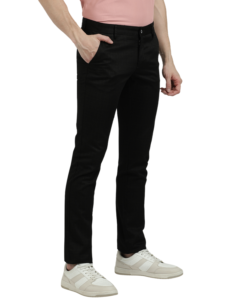 Model wearing Clarke Gable's Black Trim Fit Trousers in a casual setting