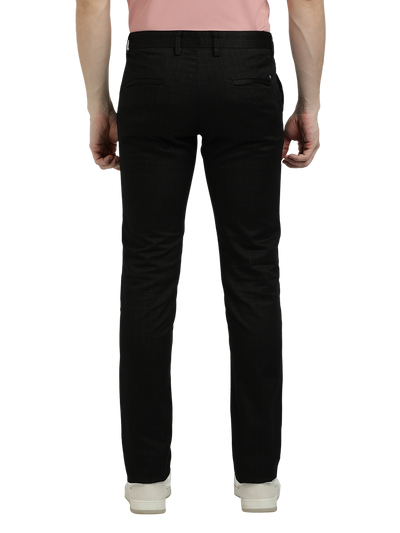 Model wearing Clarke Gable's Black Trim Fit Trousers in a casual setting