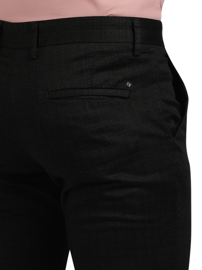 Model wearing Clarke Gable's Black Trim Fit Trousers in a casual setting