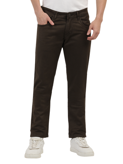 Model wearing Clarke Gable's Coolmax Coffee Skinny Fit Jeans in a casual setting