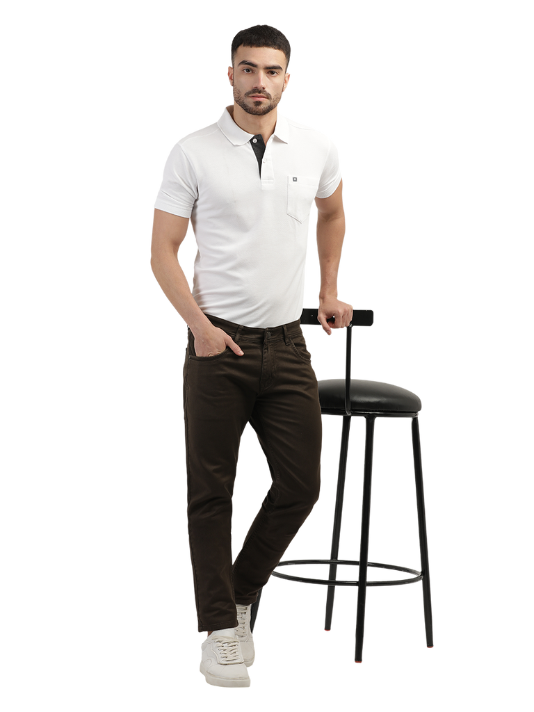 Model wearing Clarke Gable's Coolmax Coffee Skinny Fit Jeans in a casual setting