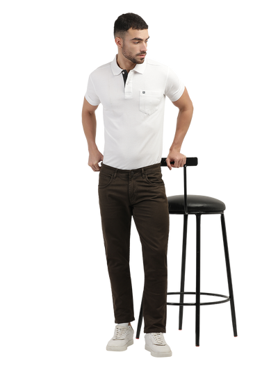 Model wearing Clarke Gable's Coolmax Coffee Skinny Fit Jeans in a casual setting