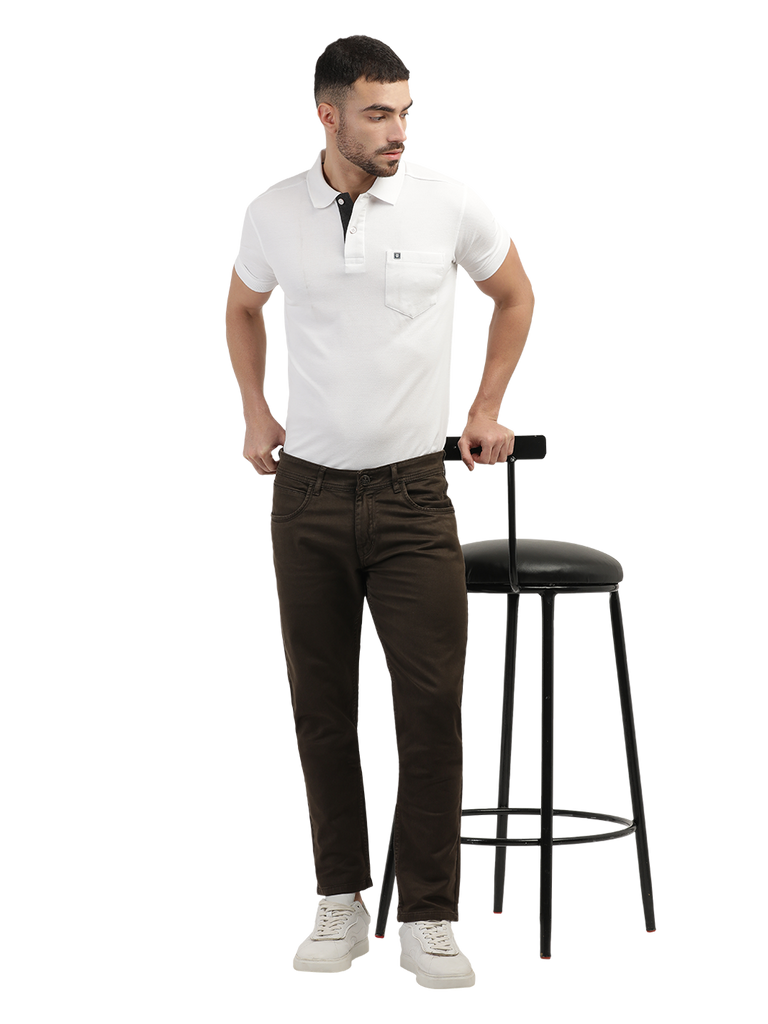 Model wearing Clarke Gable's Coolmax Coffee Skinny Fit Jeans in a casual setting