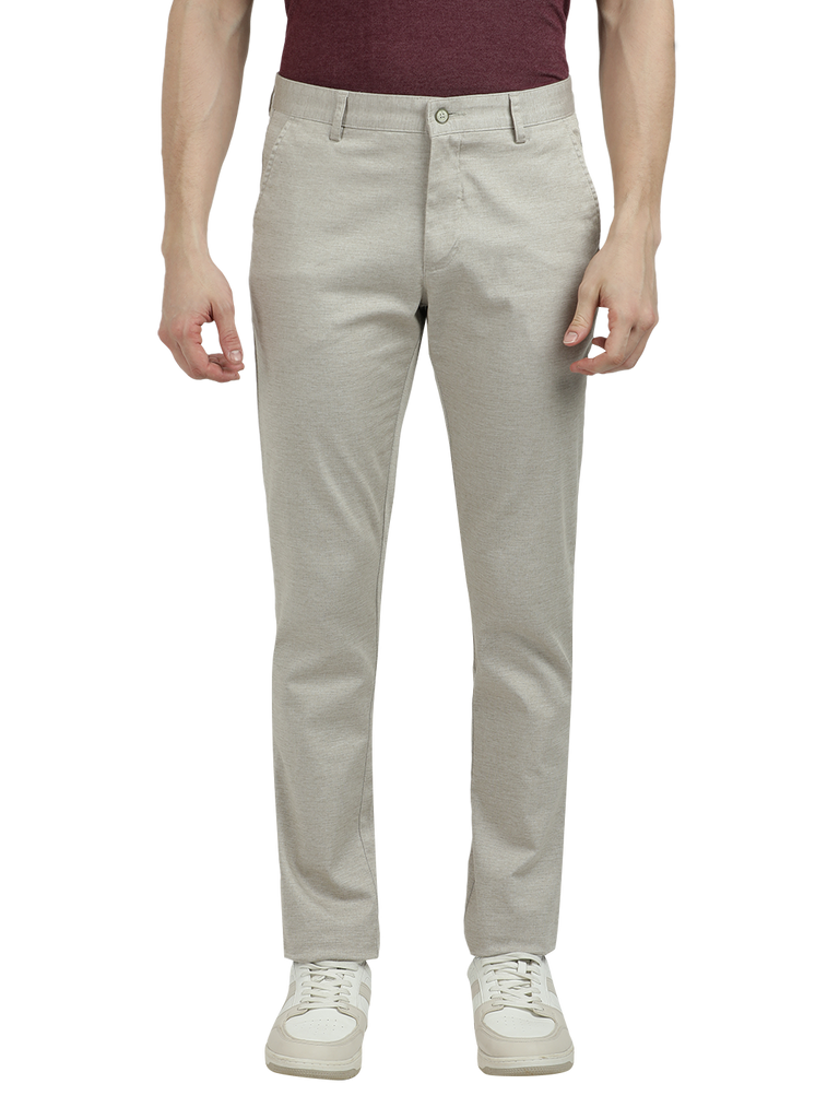 Model wearing Clarke Gable's Cream Custom Fit Trousers in a casual setting