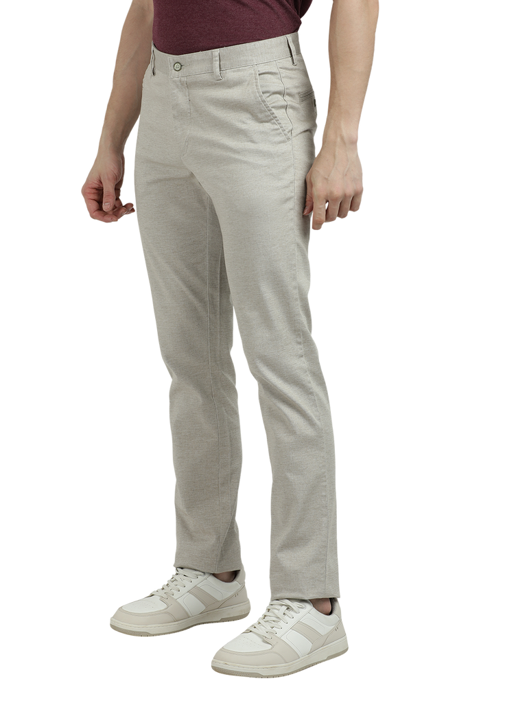 Model wearing Clarke Gable's Cream Custom Fit Trousers in a casual setting