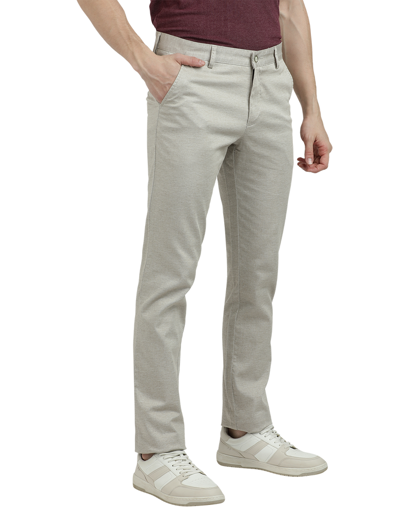 Model wearing Clarke Gable's Cream Custom Fit Trousers in a casual setting