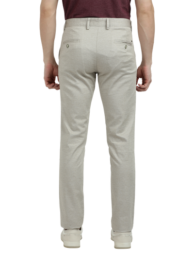 Model wearing Clarke Gable's Cream Custom Fit Trousers in a casual setting