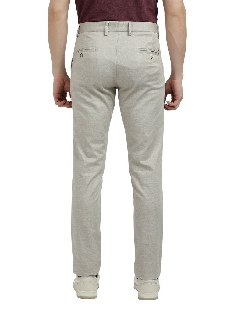 Model wearing Clarke Gable's Cream Custom Fit Trousers in a casual setting