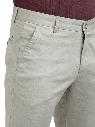 Model wearing Clarke Gable's Cream Custom Fit Trousers in a casual setting