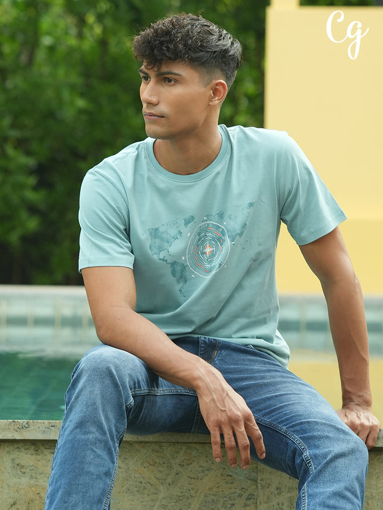 Model dressed in Clarke Gable's Mint Green Crew Neck T-Shirt in a casual setting