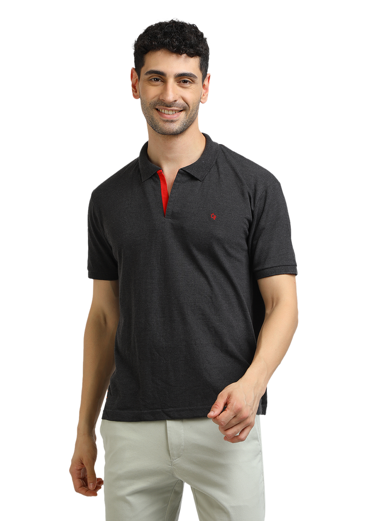 Model wearing Clarke Gable's Dark Anthra Solid Polo Collar T-Shirt in a casual setting