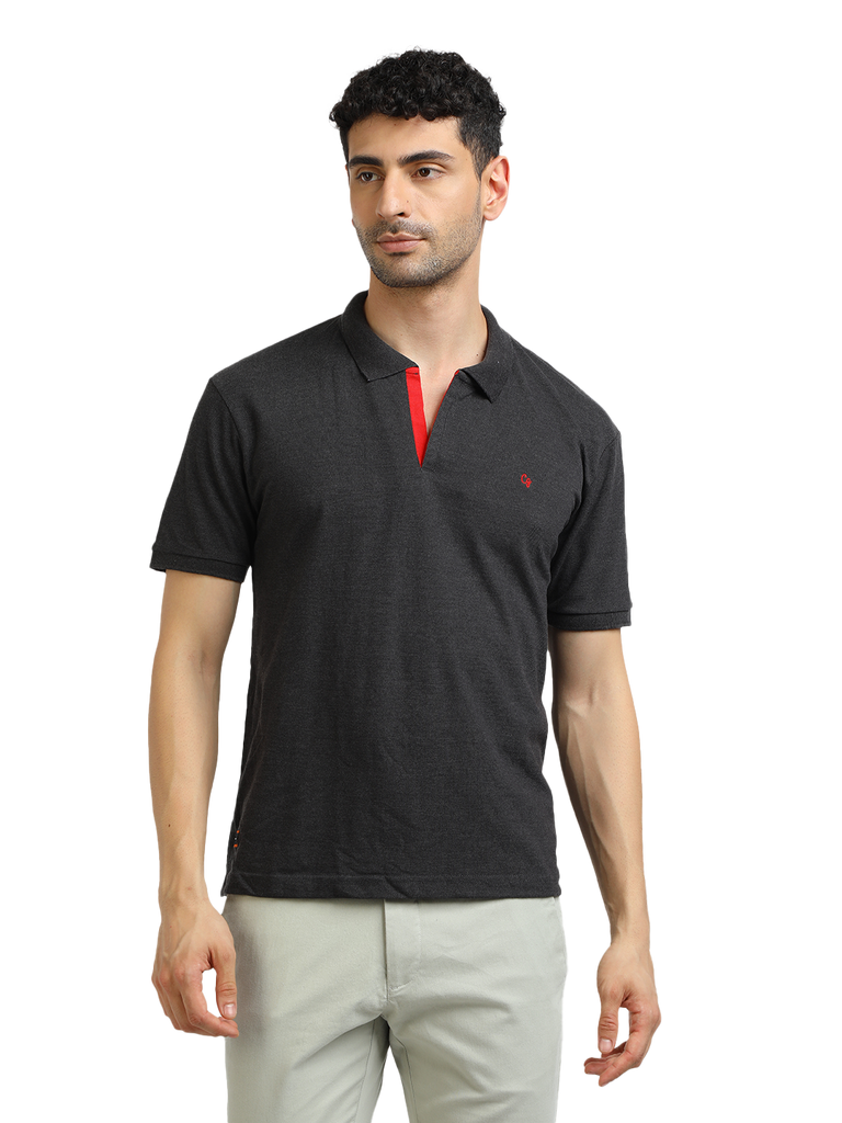 Model wearing Clarke Gable's Dark Anthra Solid Polo Collar T-Shirt in a casual setting