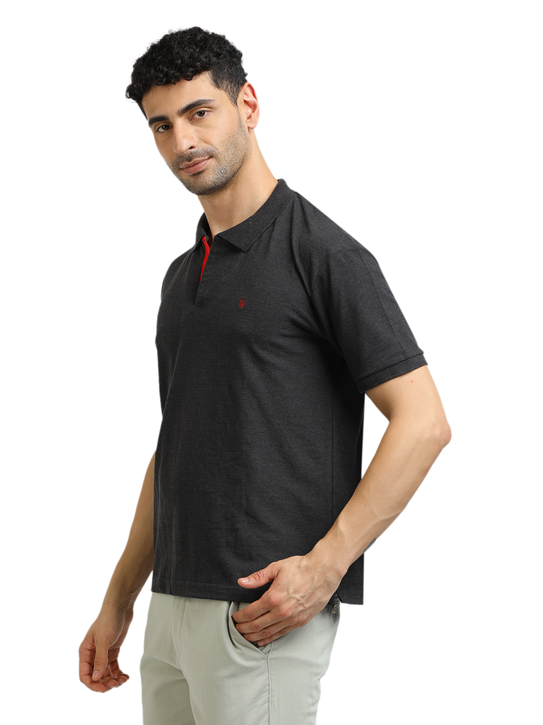 Model wearing Clarke Gable's Dark Anthra Solid Polo Collar T-Shirt in a casual setting