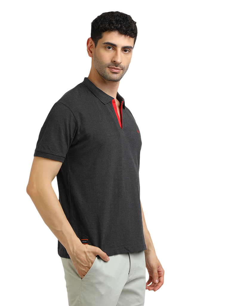 Model wearing Clarke Gable's Dark Anthra Solid Polo Collar T-Shirt in a casual setting