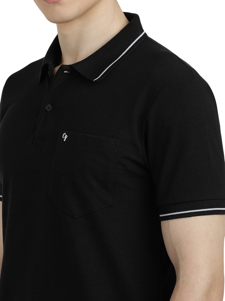 Model wearing Clarke Gable's Dark Black Solid Polo Collar T-Shirt in a casual setting